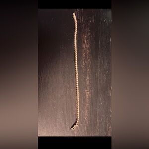 3.0 k diamond tennis bracelet, 14 c gold setting  7.5 length